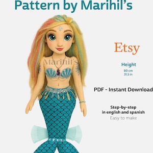 May include: A plush mermaid doll with a teal tail and a seashell top. The doll has long, colorful hair and is 31.5 inches (80 cm) tall. The image includes the text "Mermaid Plush Pattern by Marihil's" and "Etsy".