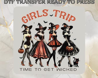 May include: DTF transfer featuring four women dressed as witches, walking together. The image includes the text "GIRLS TRIP" and "TIME TO GET WICKED" in orange. Each witch is holding a pumpkin and wearing a black hat.