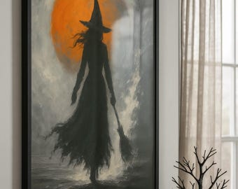 May include: A framed art print featuring a silhouette of a witch walking with a broom against an orange moon. The artwork is in a black frame, perfect for Halloween decor. A decorative pumpkin and the word "BOO" are on a shelf below.