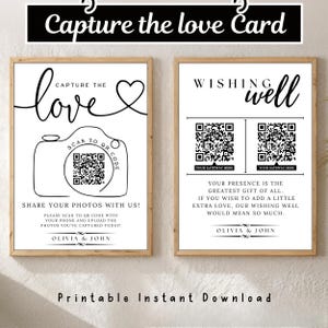 May include: Two rectangular white signs with black text and wooden frames. The left sign features a camera illustration, a QR code, and the text Capture the love. The right sign displays Wishing well, two QR codes, and the text Olivia & John.