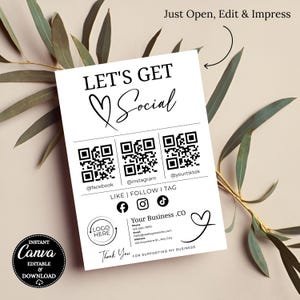 May include: A white social media business card with the text "LET'S GET Social" and QR codes for Facebook, Instagram, and TikTok. Includes social media icons and a space for a logo and business contact information. The card is surrounded by green leaves.
