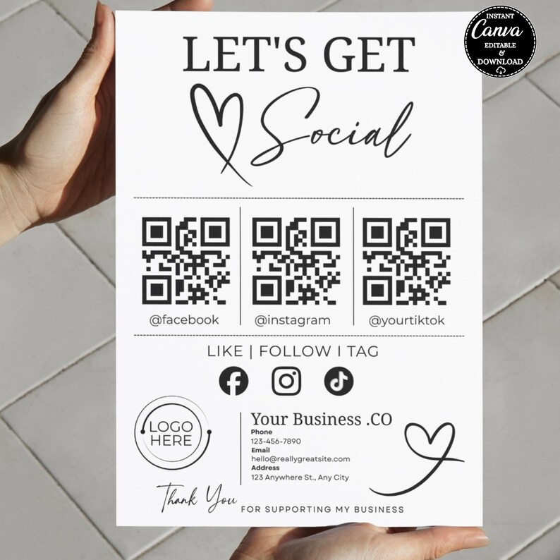 May include: A white sign with black text that reads "LET'S GET Social." It includes QR codes for Facebook, Instagram, and TikTok, along with social media icons. The sign also features a space for a logo and business contact information.