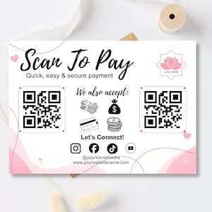 Peut inclure: Un panneau de paiement rectangulaire blanc avec des accents roses affichant le texte Scan To Pay, Quick, easy & secure payment, We also accept et Let's Connect. Il comprend deux codes QR, des icônes pour espèces, cartes et pièces.