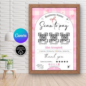 May include: A framed pink and white sign with the text "Business Name" and "Scan to pay." It includes QR codes and the words "Also Accepted: Cash Pay | Online Pay | ATM Pay | Bank Pay." The sign also says "thank you."