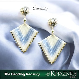 May include: A pair of handmade earrings with a geometric design. The earrings feature a diamond shape with a white and light blue pattern, outlined with gold beads. The top of the earrings have a gold circular design. The text "Serenity" is above the earrings.