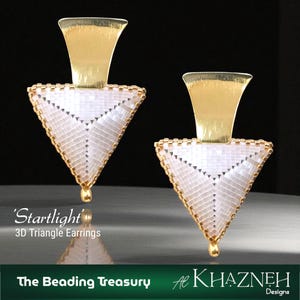 May include: A pair of 'Starlight' 3D triangle earrings. The earrings feature a gold-colored top and a white, triangular body with gold-colored trim. The earrings have a drop-shaped gold accent at the bottom. The text "The Beading Treasury" and "Al Khazneh Designs" are at the bottom.