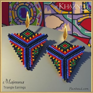 May include: A pair of Majnuna triangle earrings. These beaded earrings feature a geometric design with a gold-colored hook and a colorful pattern of red, yellow, green, and blue beads. The earrings are displayed on a light gray surface.