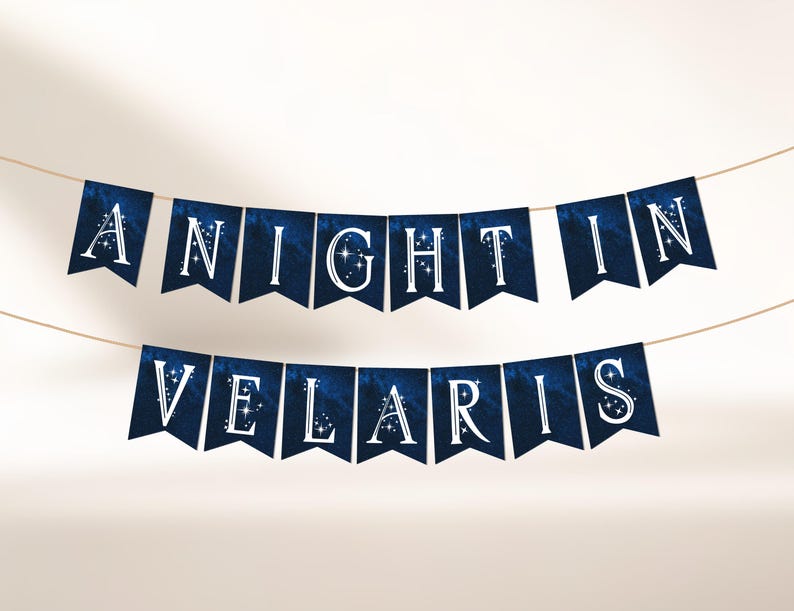 May include: A banner with pennant flags strung on a string. The flags are dark blue with white text that reads "A NIGHT IN VELARIS". The letters are outlined with a starry design.