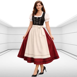 May include: A traditional German dirndl dress. The dress features a black bodice with silver-colored chain details, a white blouse with puffed sleeves, and a cream-colored apron. The skirt is a deep red color with black trim. The woman is wearing black high heels.