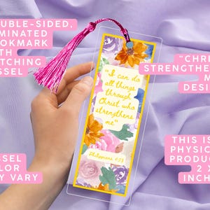 May include: Double-sided, laminated bookmark with a floral design and the text "I can do all things through Christ who strengthens me." Includes a matching pink tassel. The bookmark measures 2 x 6 inches.