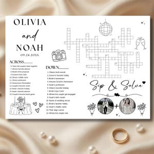Puede incluir: Un crucigrama de boda blanco con los nombres "Olivia y Noah" y la fecha "09.24.20XX" en la parte superior. El rompecabezas incluye pistas y las palabras "Sip & Solve". También se incluye una foto de la pareja y un anillo de oro.