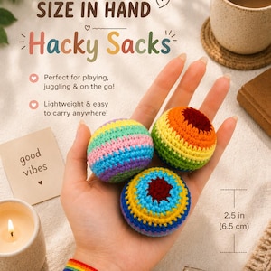 May include: Three round, crocheted hacky sacks featuring vibrant, multi-colored striped patterns. Each ball measures 2.5 inches in diameter. The text on the image reads: SIZE IN HAND, Hacky Sacks, Perfect for playing, juggling & on the go!, Lightweight & easy to carry anywhere!, good vibes.