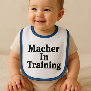 Macher In Training Baby Bib - Funny Baby Gift, Infant Feeding Bib, Cute Bib for New Parents, Baby Shower Gift, Unique Baby Apparel
