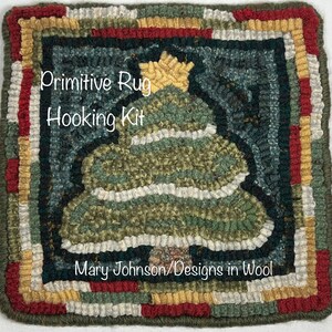 May include: A square, handcrafted rug hooking kit featuring a Christmas tree design. The tree is green with white accents and a yellow star, set against a dark teal background. The border is a mix of red, green, yellow, and white. Text reads "Primitive Rug Hooking Kit" and "Mary Johnson/Designs in Wool."