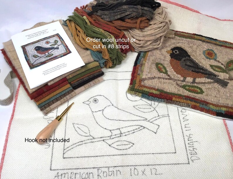 May include: A rug hooking kit featuring an American Robin design. The kit includes wool strips in various colors, a printed pattern, and a finished example. The text on the pattern reads "American Robin 10 x 12". The hook is not included.
