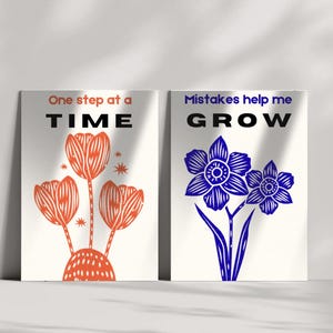 May include: Two art prints with inspirational quotes. One features orange tulips and the text "One step at a TIME." The other displays blue daffodils and the text "Mistakes help me GROW." Both are on a white background.
