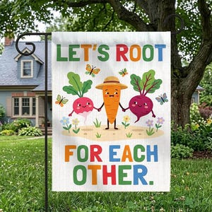 May include: A rectangular garden flag featuring a cartoon carrot, radish, and beet holding hands. The text reads LET'S ROOT FOR EACH OTHER in colorful letters. The design includes small butterflies and flowers on a white background.