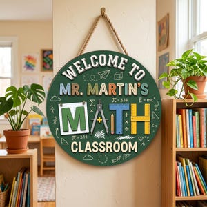 May include: A round green wooden sign with a rope hanger featuring the text "WELCOME TO MR. MARTIN'S MATH CLASSROOM". The design includes a compass, a pencil, a ruler, a square, and maths symbols like pi and E=mc2 printed on the surface.
