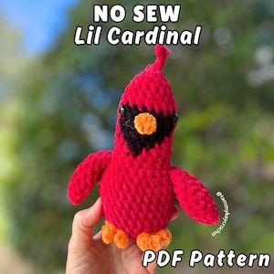 May include: A white ceramic mug with a black handle and the text "But First, Coffee" in a bold, black font. The mug is set against a neutral background, highlighting its simple design.