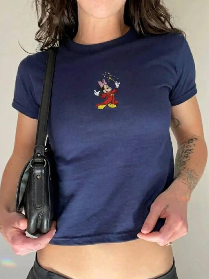 May include: A handmade wooden sign with the word "Welcome" in a whimsical font. It has a distressed white background and a dark brown border, suitable for a front door or hallway.