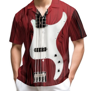 May include: Red short-sleeve button-down shirt with a white bass guitar design. The shirt features a wood grain pattern and a black and white guitar neck graphic. The shirt is paired with white pants.