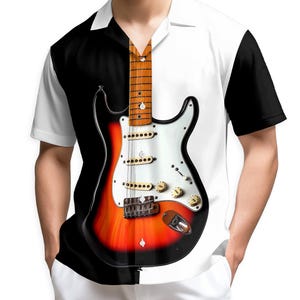 May include: A short-sleeved shirt featuring a split design with a black and white color scheme. The shirt's front displays a detailed illustration of an electric guitar in shades of red, orange, and white, with gold-colored knobs and a brown neck.