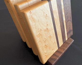 Handcrafted walnut & birdseye maple coaster set with holder. Finished in Rubio Monocoat for a rich, durable, natural sheen.