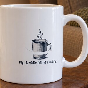 White ceramic mug printed with a looping arrow around a coffee cup and the caption Fig. 3. while (alive) { code(); }, in blue-black ink with red accents
