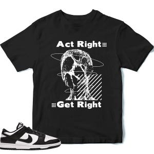 May include: Black t-shirt with white graphic art and text that reads "Act Right" and "Get Right". A pair of black and white sneakers with a swoosh logo are in the foreground.