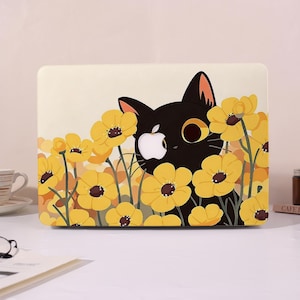 May include: A laptop case with a design of a black cat amongst yellow flowers. The cat has large eyes and a white Apple logo. The flowers have brown centres and are set against a cream background.