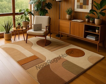 May include: A rectangular area rug with a geometric design in shades of brown, beige, and tan. The rug features curved and rectangular shapes, creating a modern aesthetic. The text "NoorRugsHome" is visible on the rug.