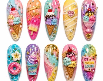 May include: Ten almond-shaped artificial nail tips decorated with 3D charms including ice cream cones, popsicles, donuts, and flowers. The designs feature vibrant pastel colors, glitter, gold accents, and text reading Summer Vibes and Ice Cream Lover.