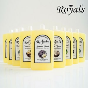 May include: Ten yellow glass bottles with black labels and white text. The bottles are filled with a clear liquid and have a reed diffuser oil label. The labels feature different scents, including Lavender & Vanilla, Mint & Eucalyptus, and Fresh Linen. The bottles are arranged in a row on a white surface. The text on the label reads "Royals" with a crown above the word. The text below the word "Royals" reads "Quality Fragrances Made in UK".