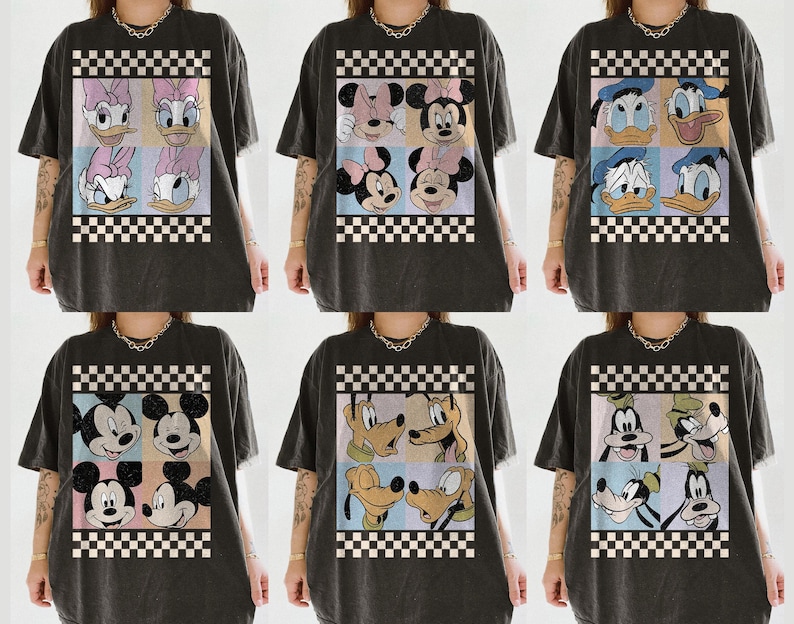 May include: Dark gray t-shirts featuring various Disney character designs. Each shirt showcases a different arrangement of characters like Daisy Duck, Minnie Mouse, Donald Duck, Mickey Mouse, Pluto, and Goofy, set against a checkered background.