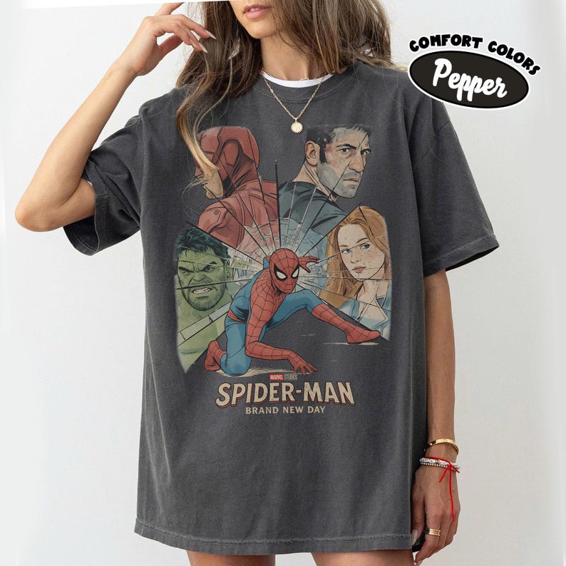 May include: A white ceramic mug with a black handle and the text "But First, Coffee" in a black, handwritten-style font. The mug is on a white surface.