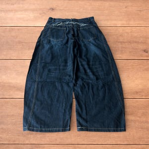 Vintage style baggy wide leg skater fit jeans in dark blue.