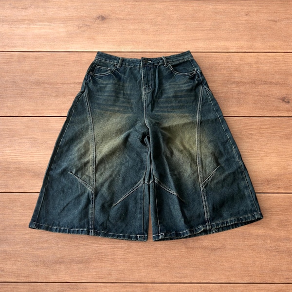 Baggy wide leg denim shorts jorts in washed dark blue.