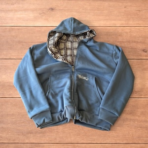 Sudadera con capucha reversible de corte holgado y extragrande, con cremallera, en color azul marino a cuadros.