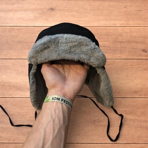 Russian ushanka trapper ear flap winter hat in black grey colour way.