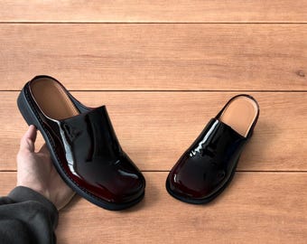 Faux leather slip on clogs slippers in oxblood red.
