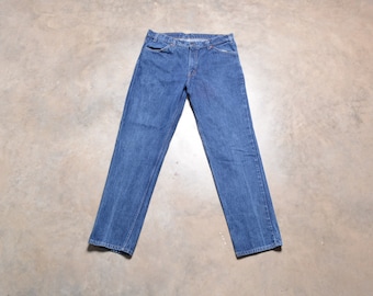 vintage 80s Levi's 506 jeans etiqueta naranja Levis lavado medio oscuro denim ajuste regular 38x34 38L 38 cintura largo alto
