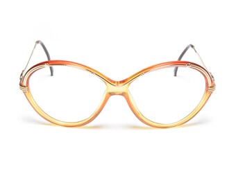 Gafas vintage de los años 80 y 90 Christian Dior Optyl, monturas de gafas oversize en tono dorado, metal, rojo, amarillo y naranja, moda mujer 1980-1990 Austria