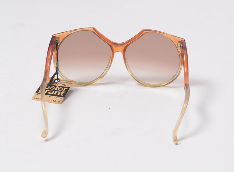 vintage 60s 70s sunglasses clear orange plastic frame brown tint lens Foster Grant oversize bug eye bugeye 1960 1970 fashion style NOS