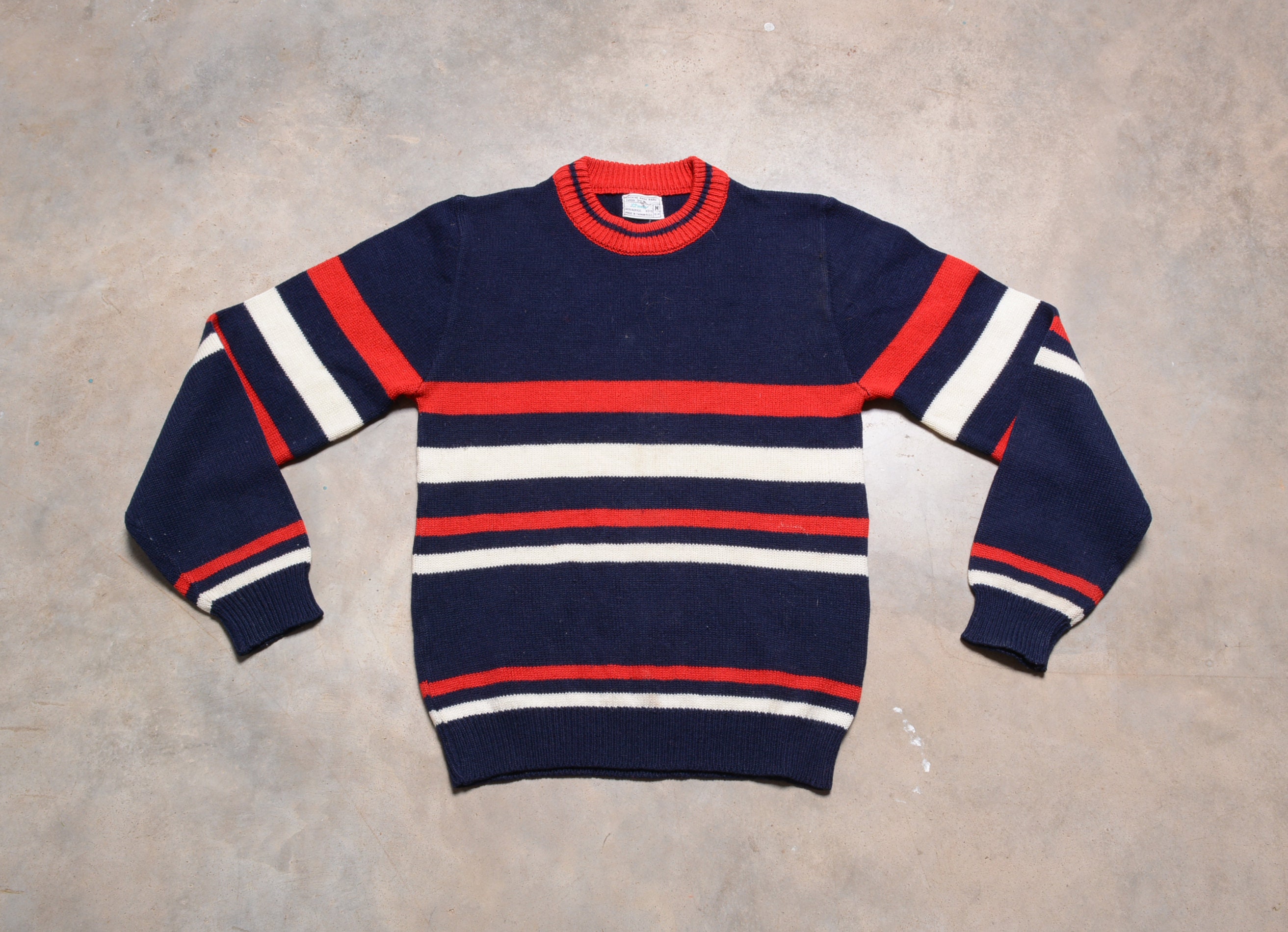 red and blue sweaters