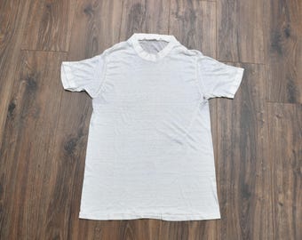 Camiseta blanca vintage de los años 70 con cuello redondo, estilo años 70, transparente y de tejido fino, talla S/M.