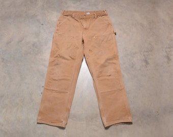 Pantalones vaqueros Carhartt vintage de los 90, de doble rodilla, de 1990, corte original, color beige, talla 36x32, talla medida 35x31.5, desgastados y rotos.