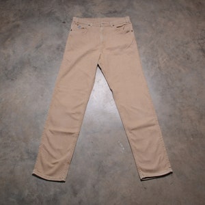 vintage Levis 550 jeans 80s 90s Levi&#39;s tan denim silver tab made USA 33x33 tag size NOS deadstock 33L relaxed fit