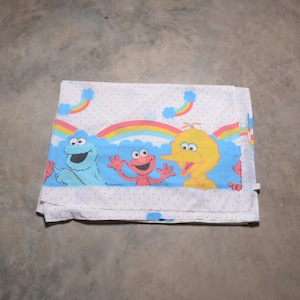 rare vintage 70s 80s bed sheet Sesame Street polka dot rainbow cloud pattern Big Bird Cookie Monster Elmo 1970 1980 linen fabric twin flat