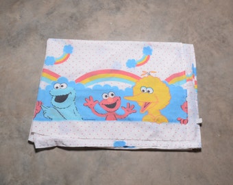 rare vintage 70s 80s bed sheet Sesame Street polka dot rainbow cloud pattern Big Bird Cookie Monster Elmo 1970 1980 linen fabric twin flat