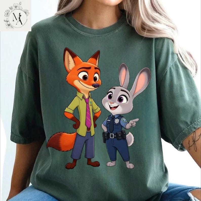 A green t-shirt with a graphic of two cartoon characters, a fox and a rabbit, standing together.